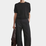 Rachel Comey Calibra Top Black styled with relaxed trousers and minimalist summer layering
