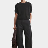 Rachel Comey Calibra Top Black styled with relaxed trousers and minimalist summer layering
