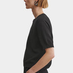 Rachel Comey Calibra Top Black side profile with textured cotton knit and relaxed short sleeve silhouette
