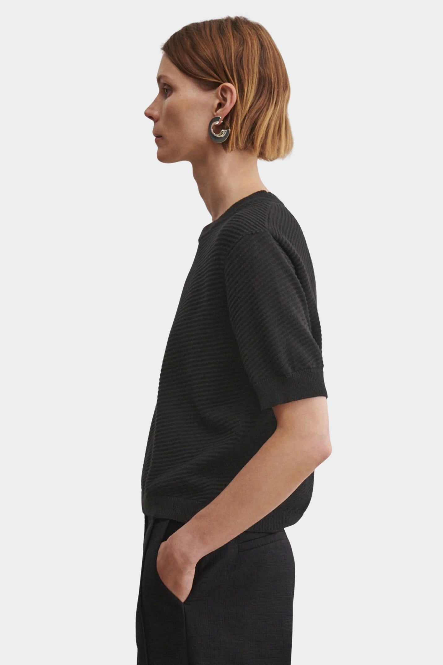 Rachel Comey Calibra Top Black side profile with textured cotton knit and relaxed short sleeve silhouette