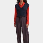 Rachel Comey navy V-neck knit vest layered styling with wide leg trousers