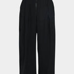 Rachel Comey Dini pant in black, flat lay showing wide-leg shape and structured silhouette