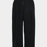 Rachel Comey Dini pant in black, flat lay showing wide-leg shape and structured silhouette