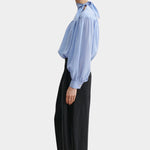 Rachel Comey Dini pant in black, side profile showing clean tailored line and subtle volume through the leg