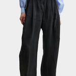 Rachel Comey Dini pant in black with high waist, wide-leg silhouette, and soft front pleating, styled with blue blouse