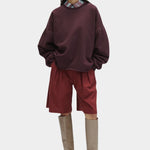 Rachel Comey Fonder Sweatshirt Plum styled with red shorts and tall boots at YUCCA Denver