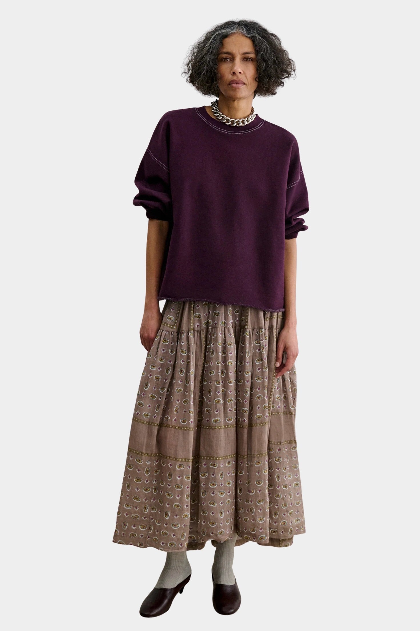 Rachel Comey Fond Sweatshirt Plum styled with a printed midi skirt and sculptural heels