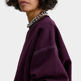 Rachel Comey Fond Sweatshirt Plum close view showing dropped shoulder and contrast stitching