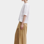Rachel Comey rugby top in white cotton, side profile highlighting relaxed drape and slightly cropped length