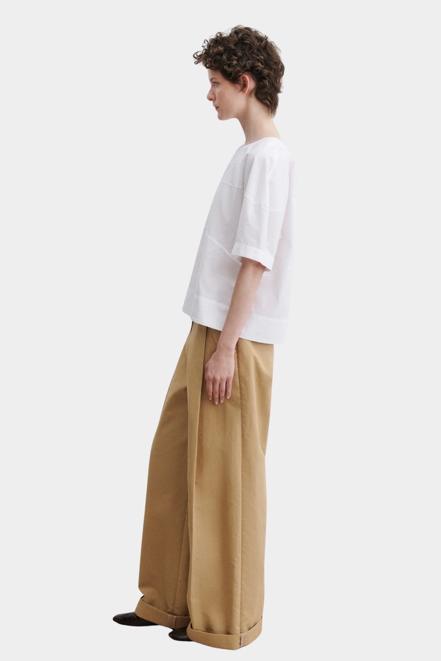 Rachel Comey rugby top in white cotton, side profile highlighting relaxed drape and slightly cropped length
