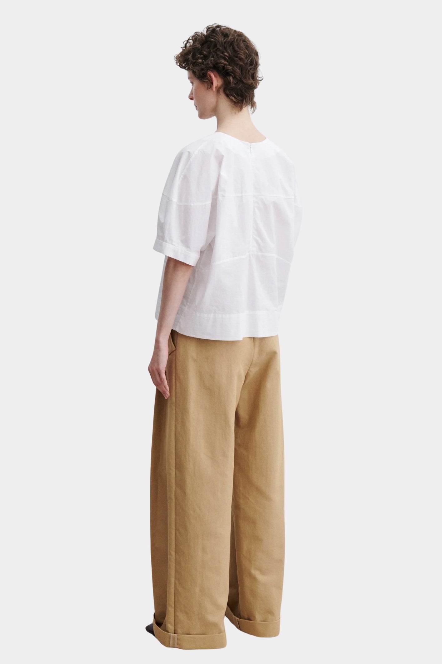 Rachel Comey rugby top in white cotton, back view showing clean structure, relaxed silhouette, and panel construction