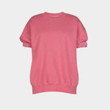 Stanza top in rose cotton, flat lay showing boxy shape, ribbed hem, and short puff sleeves