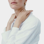 Model wearing RAGBAG Studio Datura Hoops in Gold with a white blouse, highlighting the polished finish
 Copy