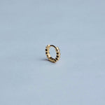 Front view of RAGBAG Studio Oda Mini Hoops with sparkling cubic zirconia stones in gold settings