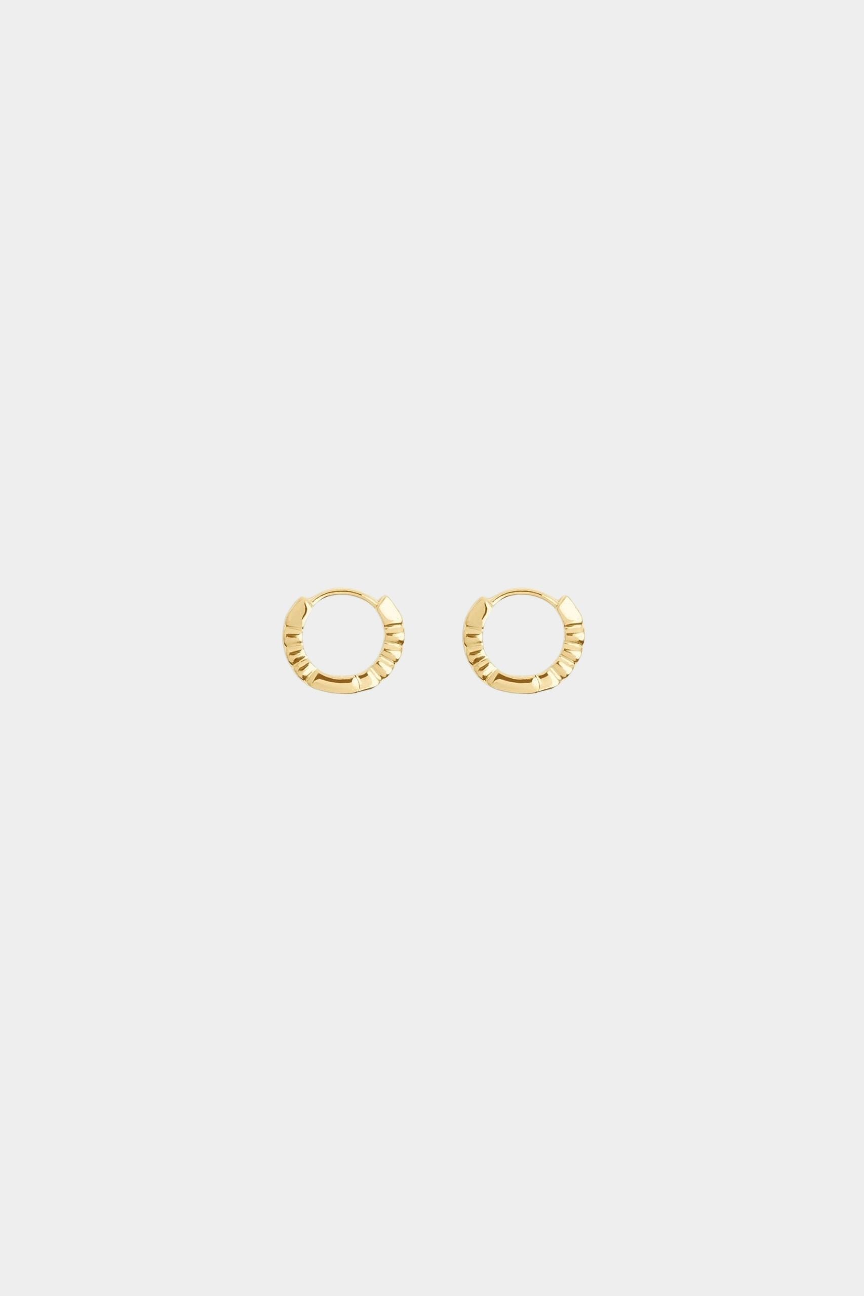 Side view of Oda Mini Hoops showing polished 18k gold plated sterling silver and hinged closures