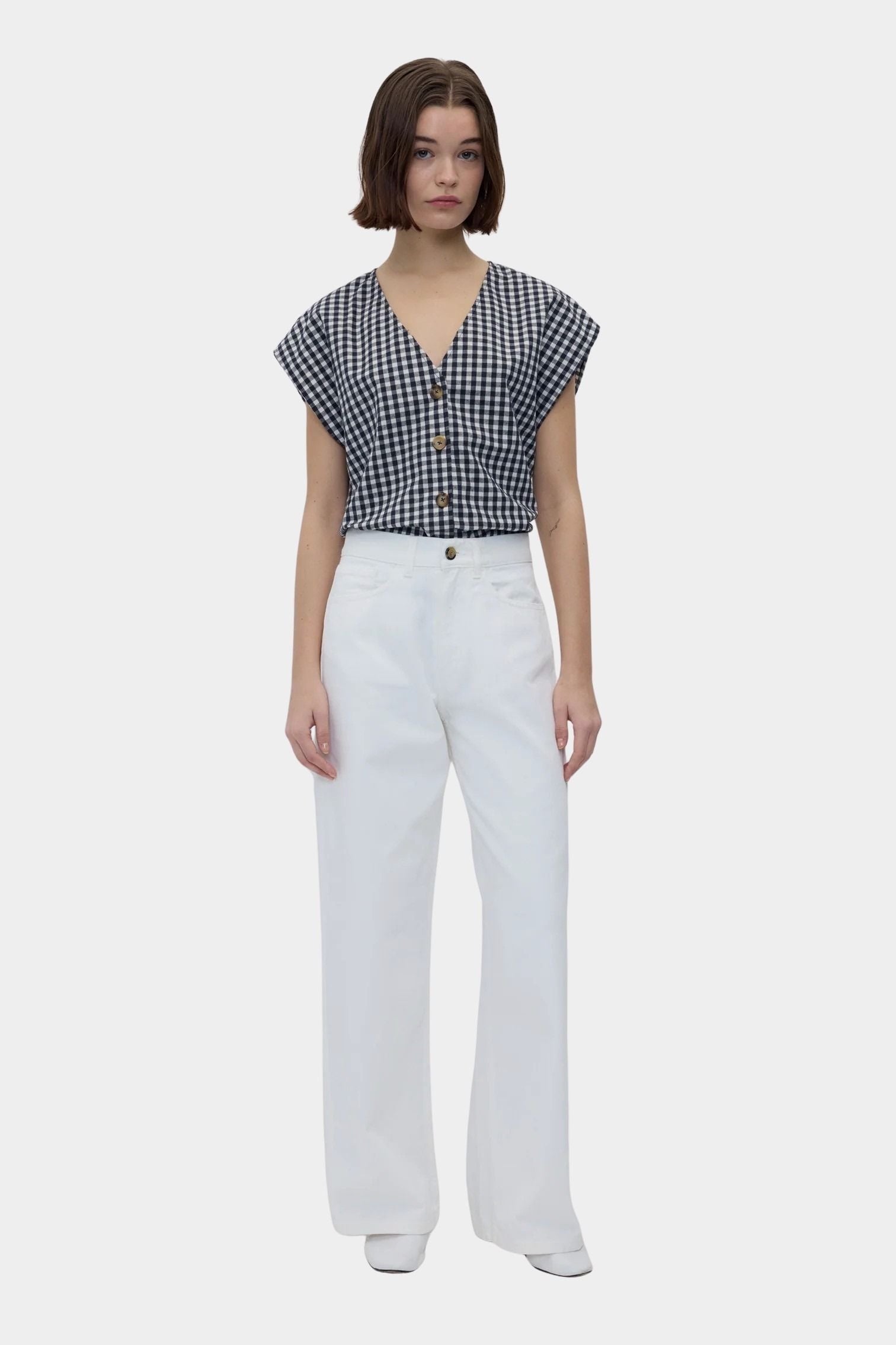 Rita Row Diana Top black gingham cotton V neck button top with cap sleeves styled with white wide leg pants full body view