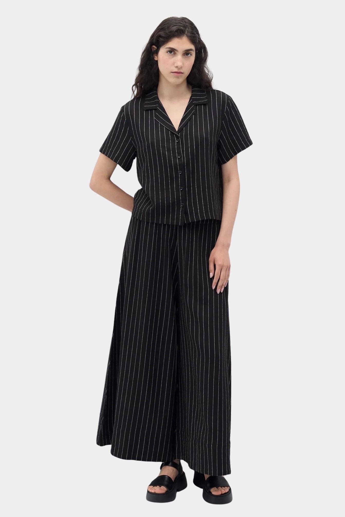 Rita Row Dolors pant in black with white pinstripe wide leg pants styled with matching short sleeve top full look
