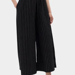 Rita Row Dolors pant in black pinstripe wide leg pants angled front view with elastic waistband and side pockets