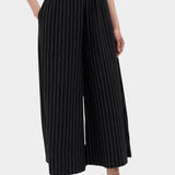 Rita Row Dolors pant in black pinstripe wide leg pants angled front view with elastic waistband and side pockets