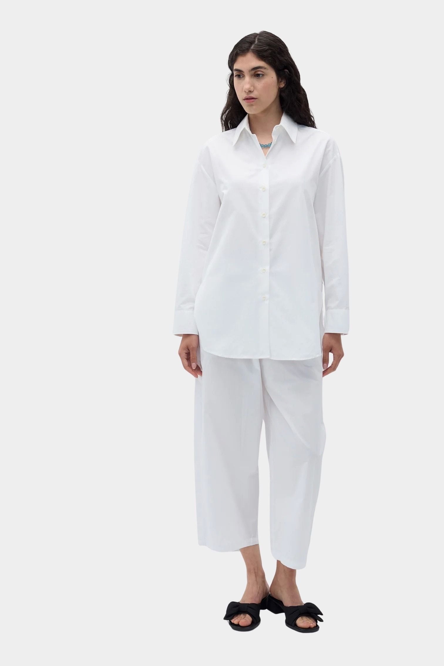 Rita Row Posets Shirt white poplin button up shirt styled with wide leg pants full body view