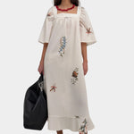 Rodebjer Salem dress cream multi back view with belt cinched waist detail