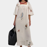 Rodebjer Salem dress cream multi back view with belt cinched waist detail