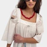 Rodebjer Salem square neck dress cream multi floral front detail model wearing sunglasses YUCCA Denver