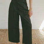 Shaina Mote Boy Trouser Onyx angled view pleated waist structured black wide leg pant