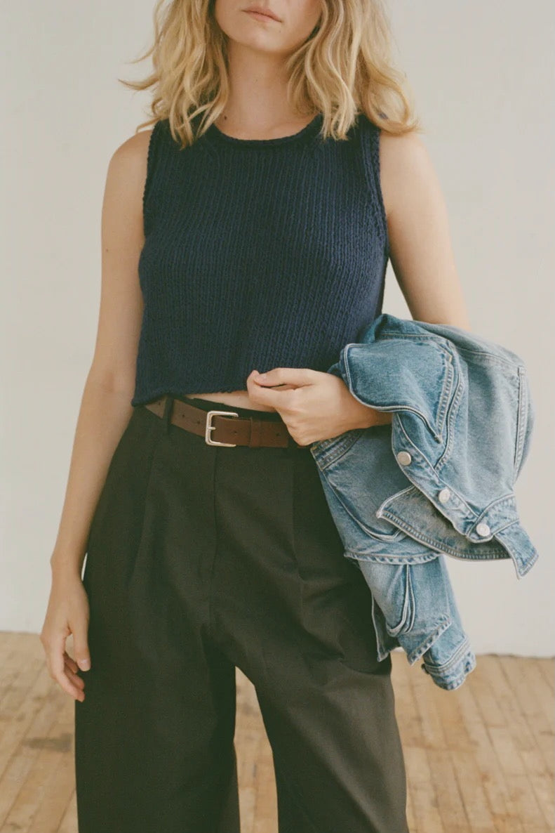 Shaina Mote Brisa Top Dark Iris cropped navy knit tank styled with black trousers and brown leather belt