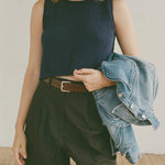 Shaina Mote Brisa Top Dark Iris cropped navy knit tank styled with black trousers and brown leather belt