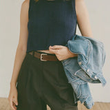 Shaina Mote Brisa Top Dark Iris cropped navy knit tank styled with black trousers and brown leather belt