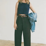 Shaina Mote Brisa Top Dark Iris textured sleeveless knit top detail styled with high-waisted black pants and denim jacket