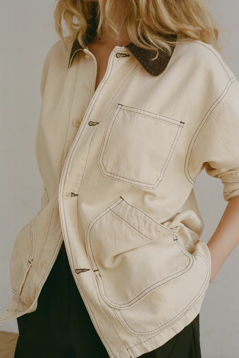 Shaina Mote Painter Coat Butter detail of front patch pockets and stitching on soft butter canvas jacket