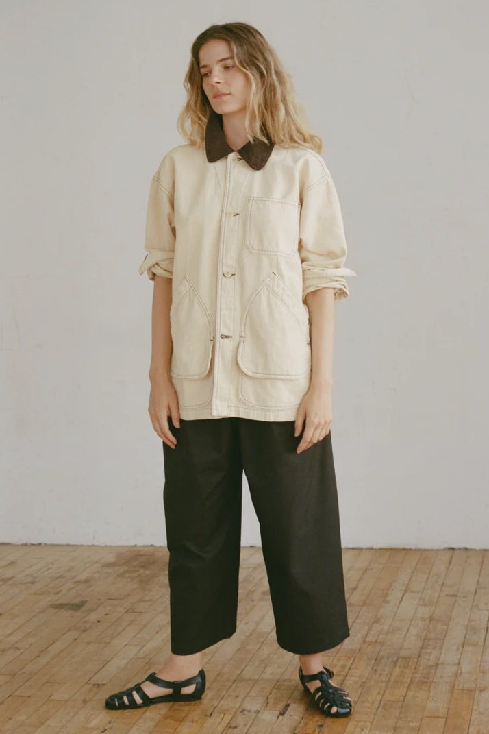 Shaina Mote Painter Coat Butter front view oversized utility jacket with contrast collar and patch pockets styled with black trousers