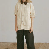 Shaina Mote Painter Coat Butter front view oversized utility jacket with contrast collar and patch pockets styled with black trousers