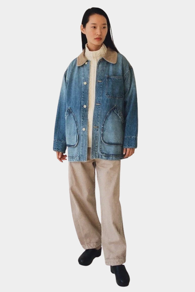 Shaina Mote Painter Coat Denim in Vintage Wash, full-length model view with cream trousers at YUCCA Denver