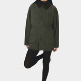 Shaina Mote Moss Painter Coat Herringbone on model, showing corduroy collar and large patch pockets at YUCCA Denver