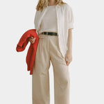 Shaina Mote Summer Chino Beige styled look relaxed wide leg chinos with white shirt and knit sweater