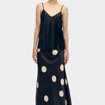 silk laundry long bias cut camisole black front view paired with polka dot skirt