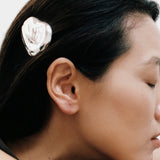 Bean Barrette Silver Wolf Circus worn in dark hair sculptural silver barrette side profile