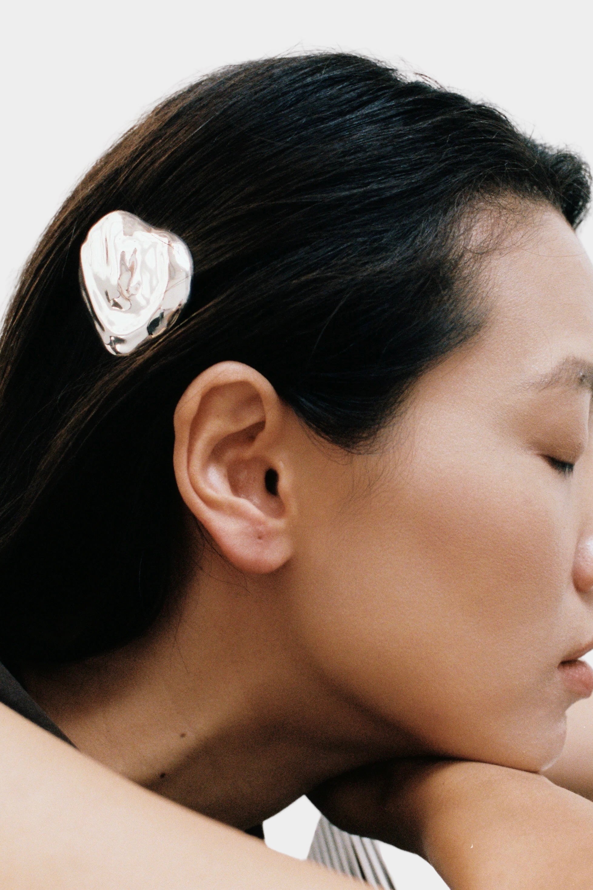 Bean Barrette Silver Wolf Circus worn in dark hair sculptural silver barrette side profile