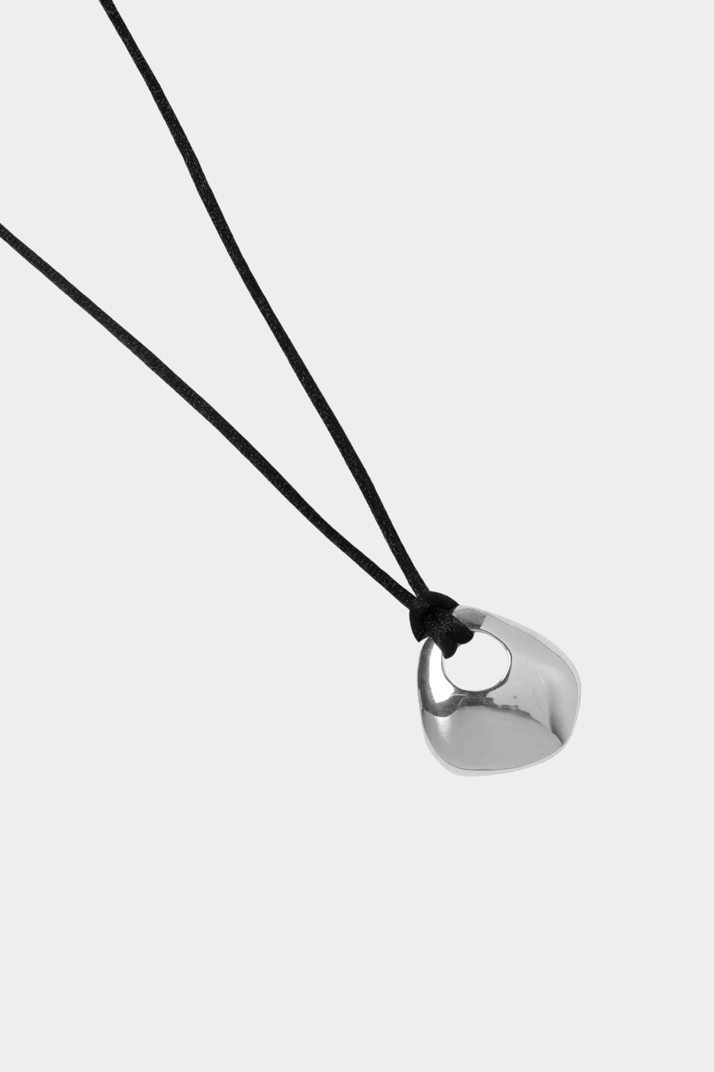 Wolf Circus Devon necklace silver organic pendant on black cord close up detail