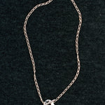 Wolf Circus Kaia necklace sterling silver curb chain on dark textured background