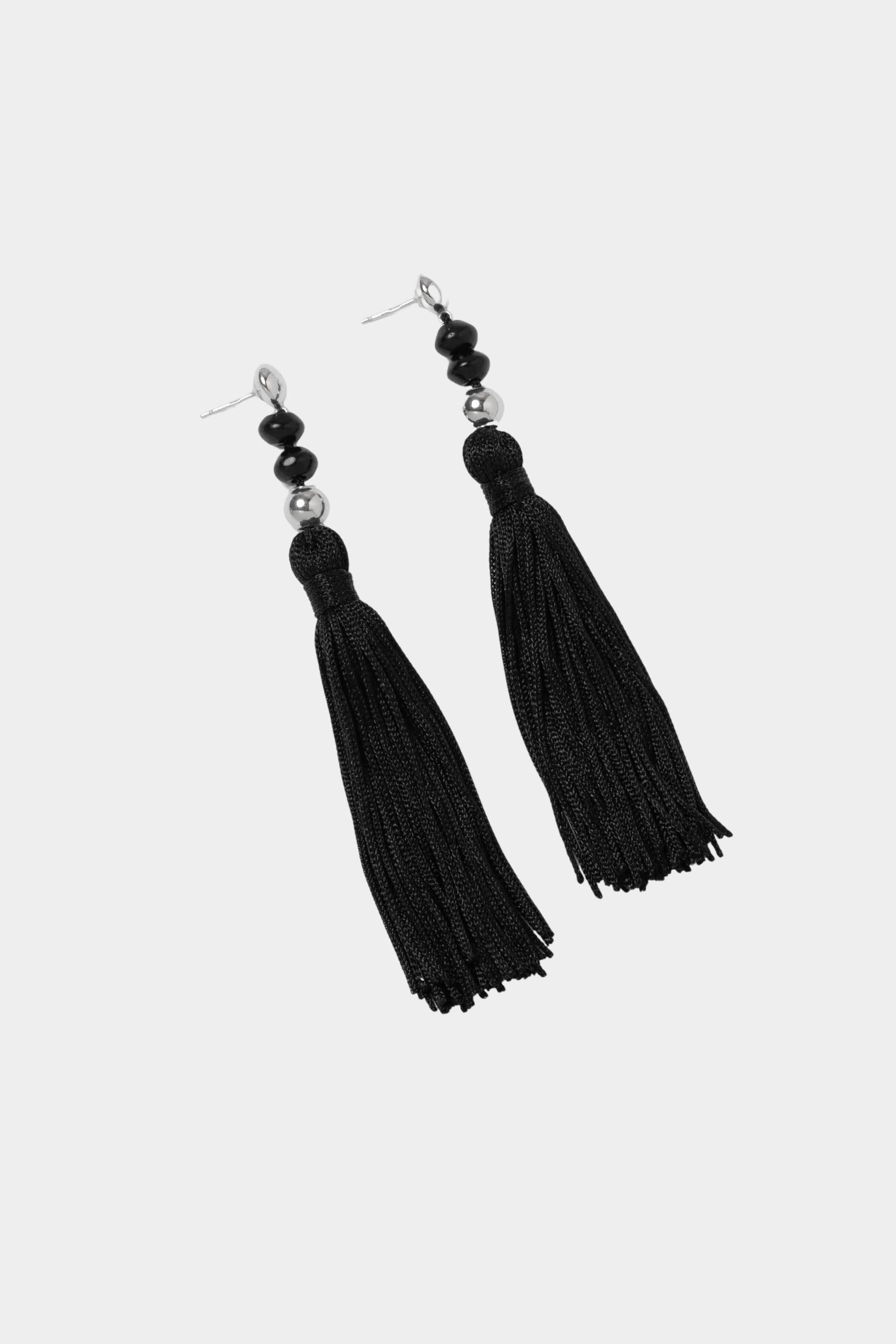 Miriam Earrings in sterling silver Wolf Circus angled flat lay black tassel earrings