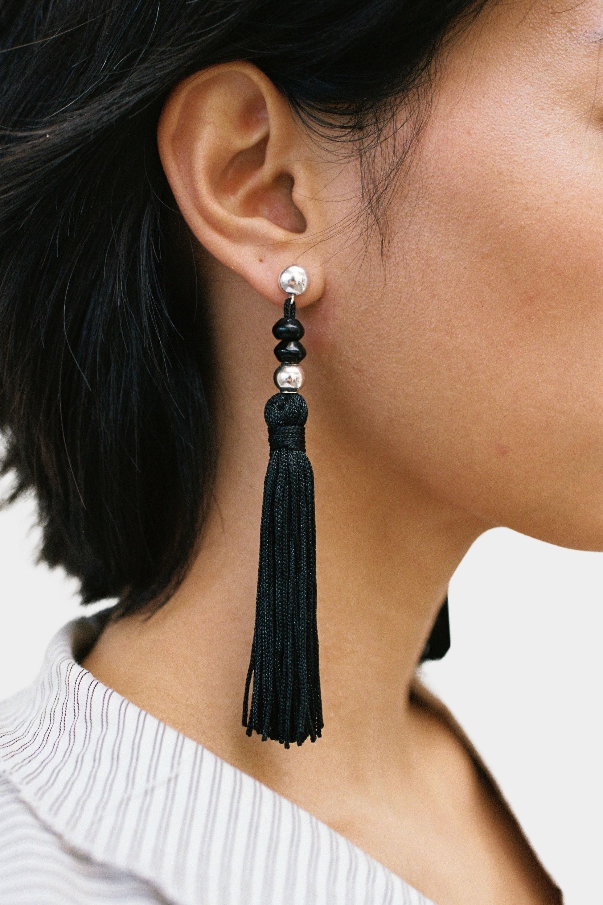 Miriam Earrings in sterling silver Wolf Circus worn side profile black tassel earrings