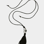 Miriam Necklace in silver Wolf Circus full necklace laid out adjustable black cord tassel pendant