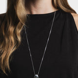 Wolf Circus Naya necklace sterling silver pendant detail worn on black top