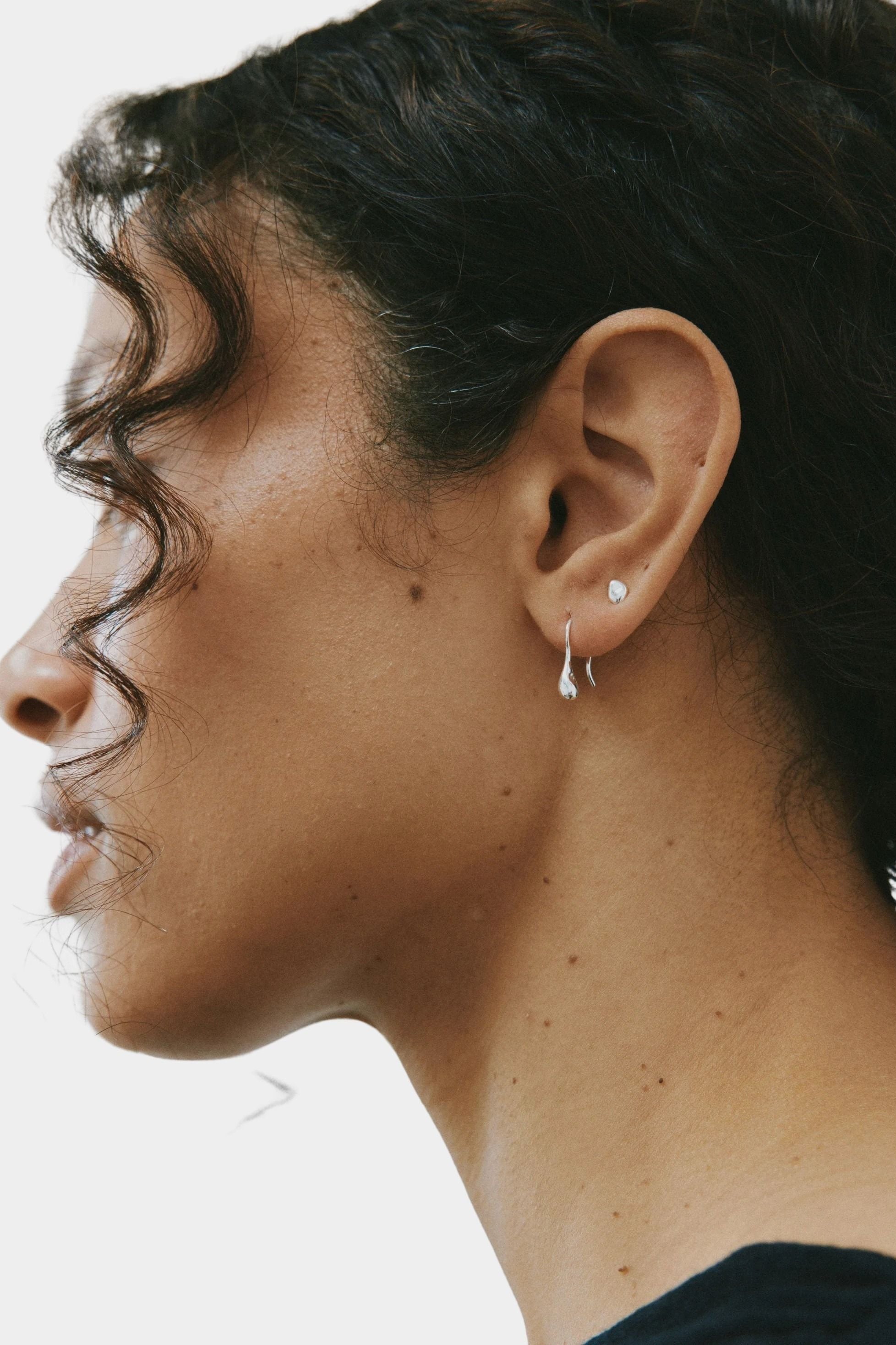 Small Sage Earrings Sterling Silver Wolf Circus side profile worn minimal drop earrings