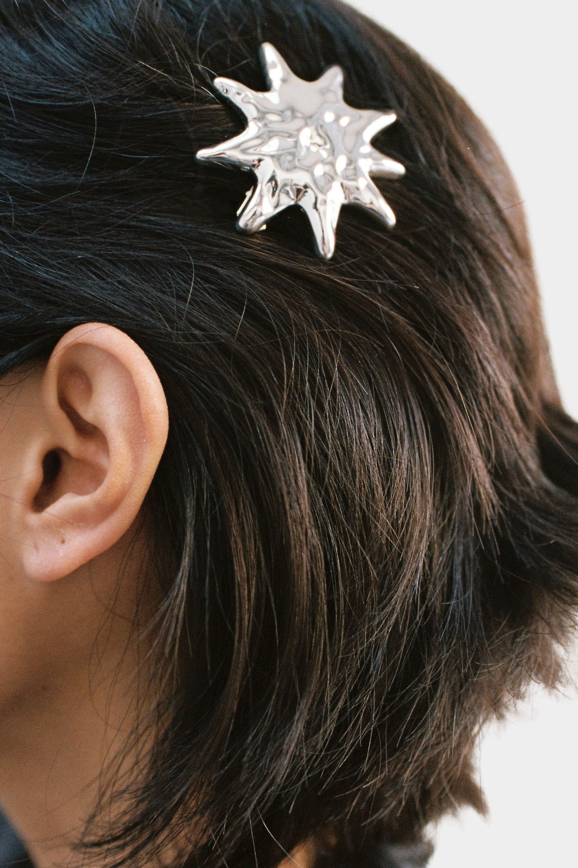 Wolf Circus Sun Barrette silver sculptural hair clip worn in short dark hair