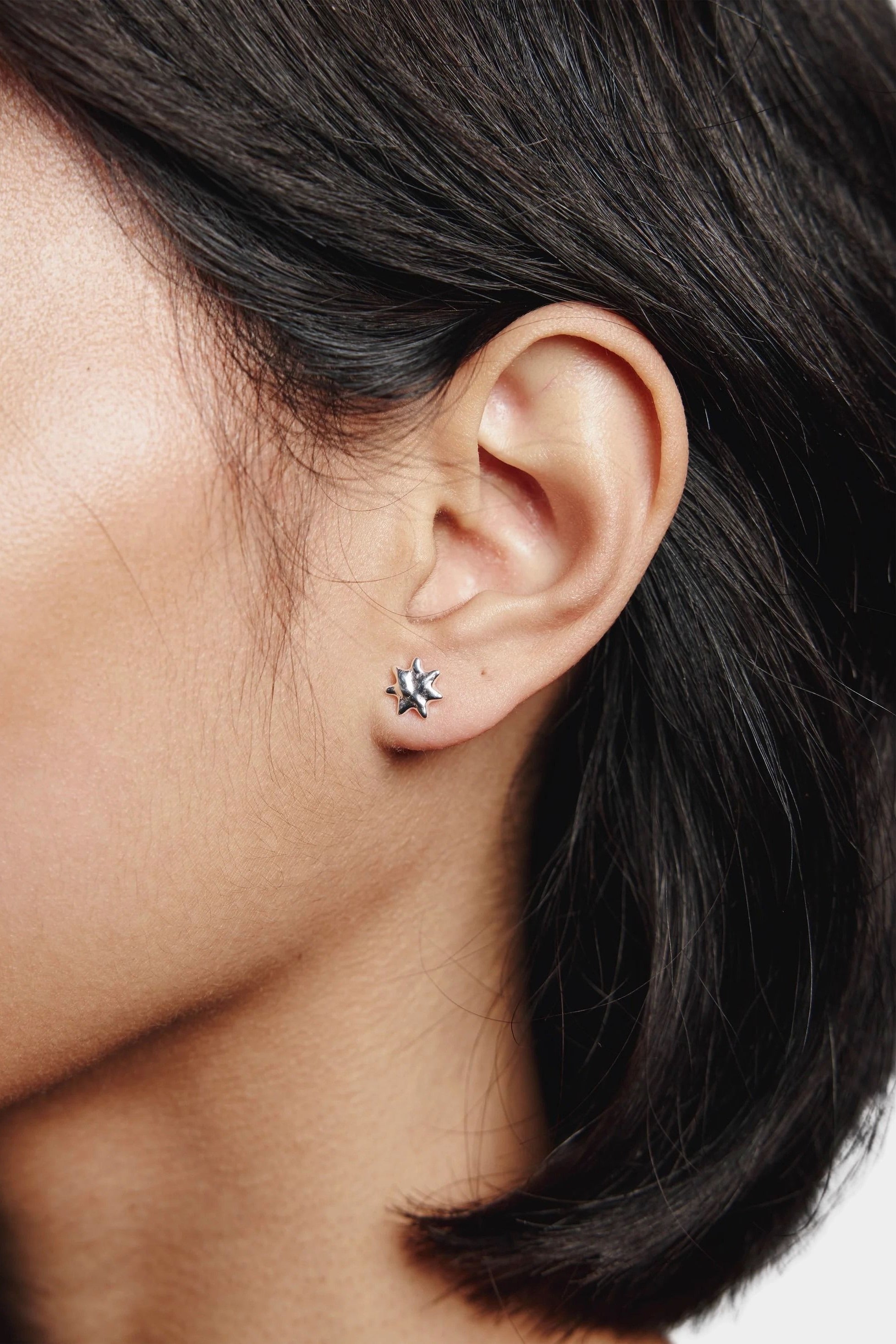 Sun Stud Earrings Sterling Silver Wolf Circus worn on ear small sunburst stud detail